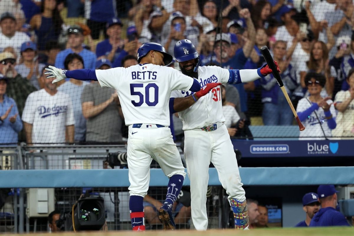 Aug 12, 2026; Los Angeles, California, USA;  Los Angeles Dodgers shortstop Mookie Betts (50) celebrates with left fielder Teoscar Hernandez (37) after hitting a home run against the Kansas City Royals in the second inning at Dodger Stadium. Mandatory Credit: Kiyoshi Mio-Imagn Images