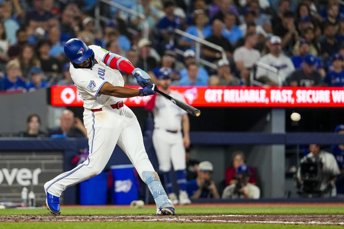 Aug 12, 2026; Toronto, Ontario, CAN; Toronto Blue Jays first baseman Vladimir Guerrero Jr. (27) hits a single against the Toronto Blue Jays during the eighth inning at Rogers Centre. Mandatory Credit: Kevin Sousa-Imagn Images