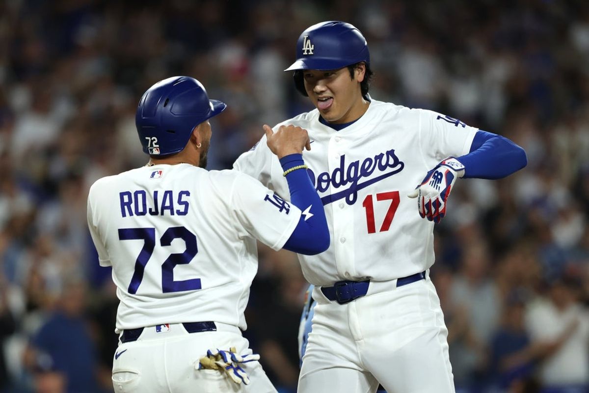 Aug 12, 2026; Los Angeles, California, USA; Los Angeles Dodgers two-way player Shohei Ohtani (17) celebrates with second baseman Miguel Rojas (72) after hitting a two run home run against the Kansas City Royals in the third inning at Dodger Stadium. Mandatory Credit: Kiyoshi Mio-Imagn Images
