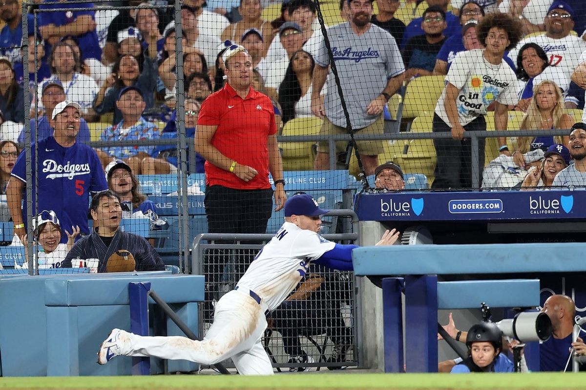 Aug 12, 2026; Los Angeles, California, USA;  Los Angeles Dodgers first baseman Freddie Freeman (5) falls into the dugout while chasing a foul ball during the eighth inning against the Kansas City Royals at Dodger Stadium. Mandatory Credit: Kiyoshi Mio-Imagn Images