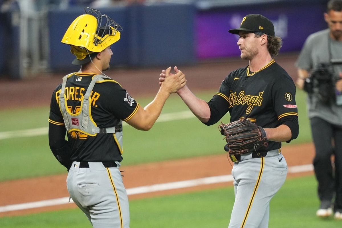 Aug 13, 2026; Miami, Florida, USA; Pittsburgh Pirates catcher Rafael Flores Jr. (43) congratulates starting pitcher Braxton Ashcraft (35) after defeating the Marlins at loanDepot Park. Mandatory Credit: Jim Rassol-Imagn Images
