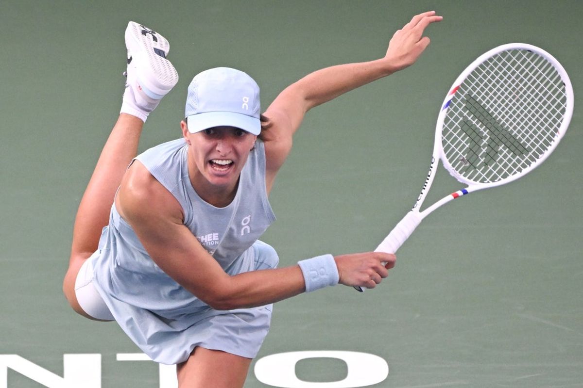 Aug 13, 2026; Toronto, Ontario, Canada; Iga Swiatek (POL) serves against Elena Rybakina (KAZ) during final round play at Sobeys Stadium. Mandatory Credit: Dan Hamilton-Imagn Images