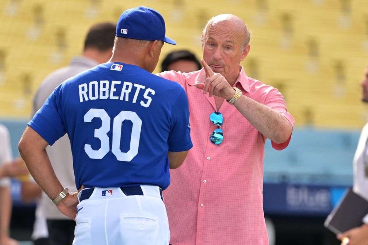 Aug 13, 2026; Los Angeles, California, USA;  Stan Kasten, Los Angeles Dodgers president, talks with manager Dave Roberts (30) on the field prior to the game against the Milwaukee Brewers at Dodger Stadium. Mandatory Credit: Jayne Kamin-Oncea-Imagn Images