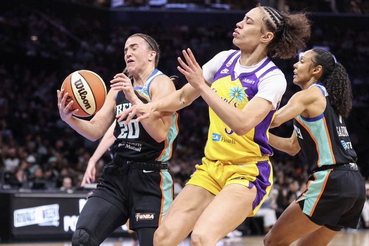 Aug 13, 2026; Brooklyn, New York, USA;  New York Liberty guard Sabrina Ionescu (20) collides with Los Angeles Sparks forward Dearica Hamby (5) in the first quarter at Barclays Center. Mandatory Credit: Wendell Cruz-Imagn Images