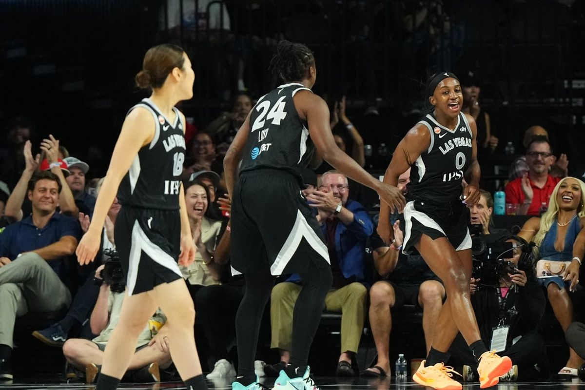 Aug 13, 2026; Las Vegas, Nevada, USA; Las Vegas Aces guard Jackie Young (0) reacts to scoring against the Washington Mystics in the first quarter of their game at Michelob Ultra Arena. Mandatory Credit: Candice Ward-Imagn Images