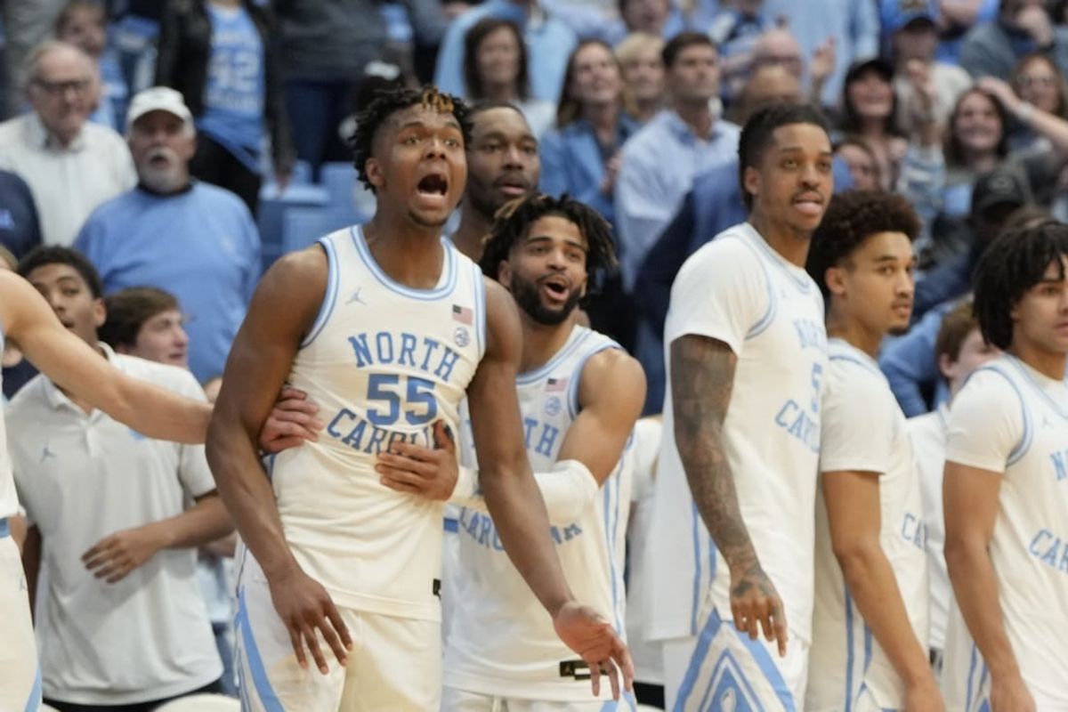 Jan 13, 2024; Chapel Hill, North Carolina, USA;  North Carolina Tar Heels bench including forward Harrison Ingram (55) and guard RJ Davis (4) and forward Armando Bacot (5) and guard Seth Trimble (7) celebrate in the second half at Dean E. Smith Center.
