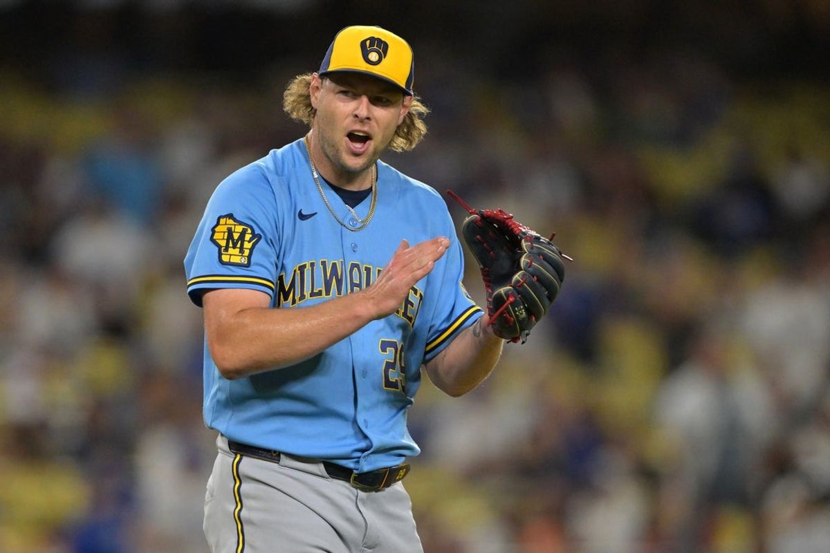 Aug 13, 2026; Los Angeles, California, USA;  Milwaukee Brewers relief pitcher Trevor Megill (29) reacts after earning a save to defeat the Los Angeles Dodgers in the ninth inning at Dodger Stadium. Mandatory Credit: Jayne Kamin-Oncea-Imagn Images