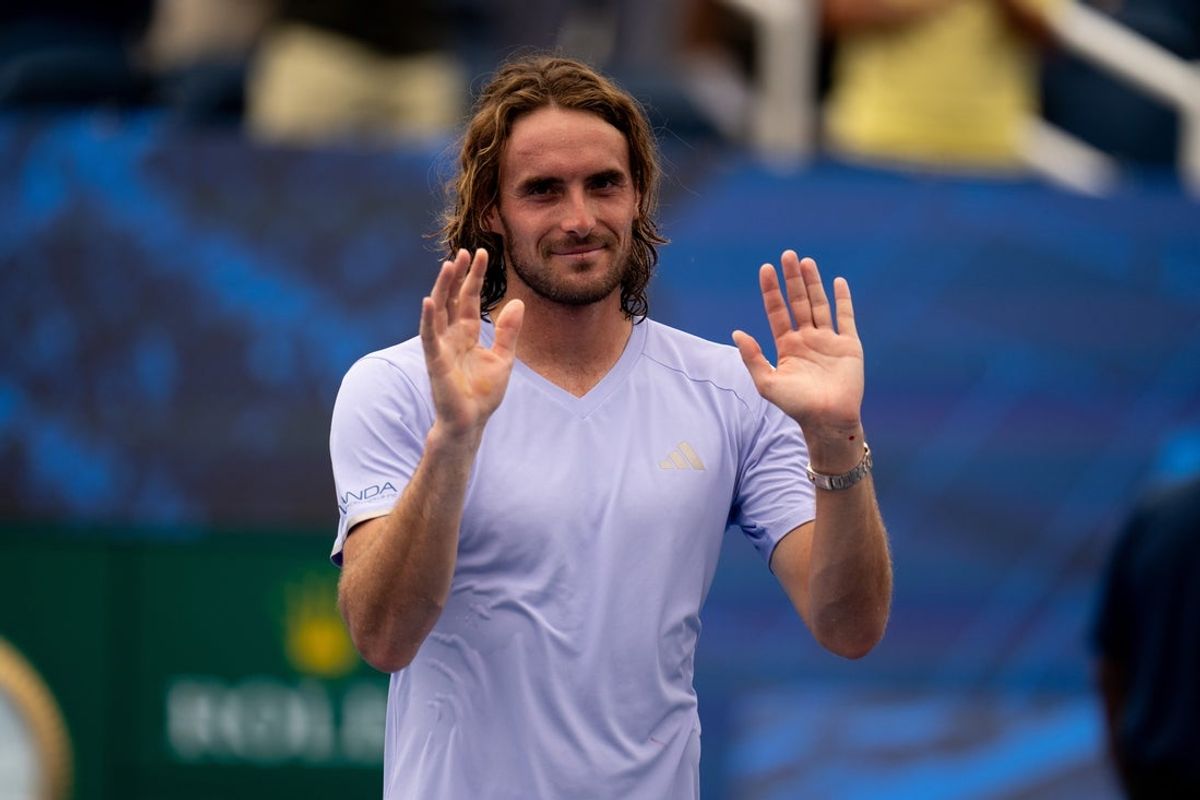 Stefanos Tsitsipas, of Greece, waives to the crowd at the Cincinnati Open at the Lindner Family Tennis Center in Mason, Ohio, on Friday, August 14, 2026.