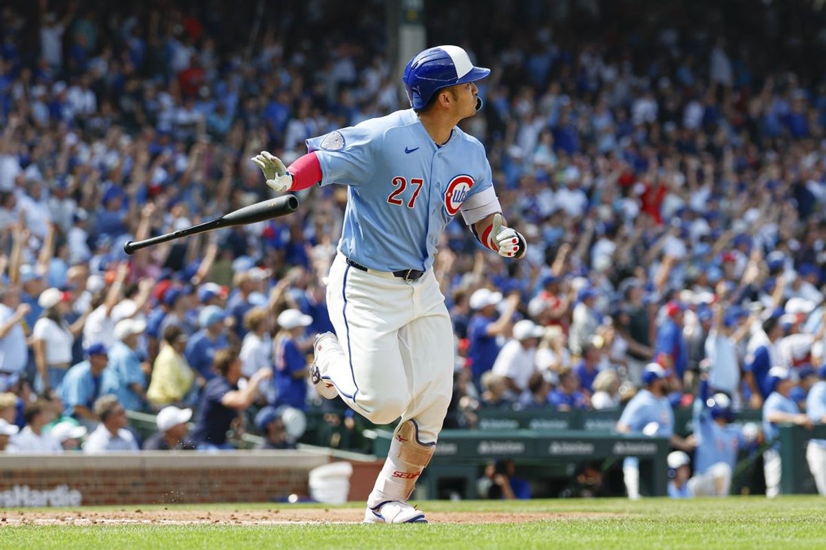 Aug 14, 2026; Chicago, Illinois, USA; Chicago Cubs designated hitter Seiya Suzuki (27) hits a three-run home run against the St. Louis Cardinals during the sixth inning at Wrigley Field. Mandatory Credit: Kamil Krzaczynski-Imagn Images
