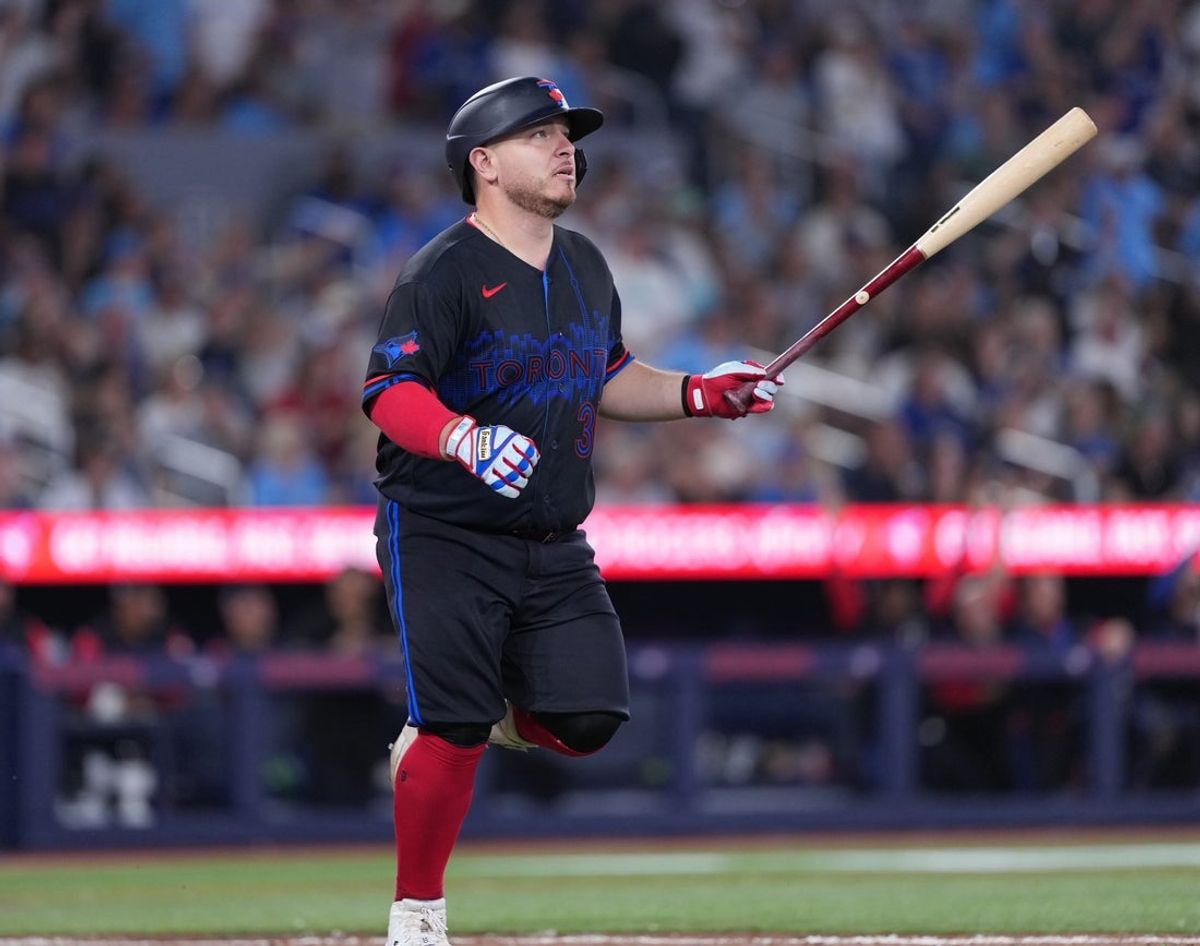 Aug 14, 2026; Toronto, Ontario, CAN; Toronto Blue Jays catcher Alejandro Kirk (30) hits a home run against the New York Yankees during the eighth inning at Rogers Centre. Mandatory Credit: Nick Turchiaro-Imagn Image