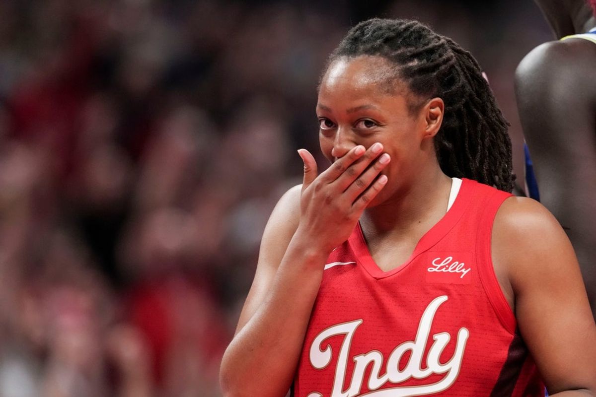 Indiana Fever guard Kelsey Mitchell (0) reacts to a basket Friday, Aug. 14, 2026, during the second half of a game at Gainbridge Fieldhouse in Indianapolis. The Indiana Fever defeated the Dallas Wings, 98-87.