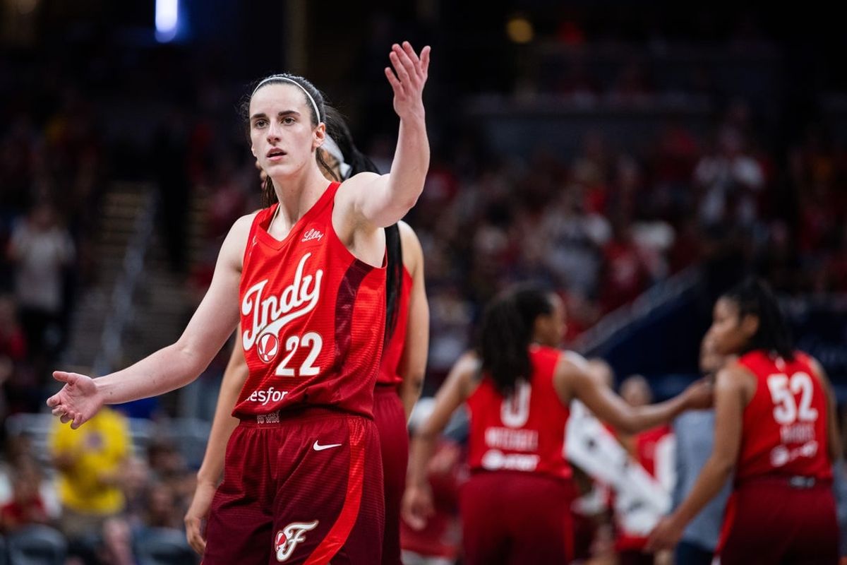 Aug 14, 2026; Indianapolis, Indiana, USA;  Indiana Fever guard Caitlin Clark (22) pumps up the crowd at a timeout in the second half against the Dallas Wings at Gainbridge Fieldhouse. Mandatory Credit: Trevor Ruszkowski-Imagn Images
