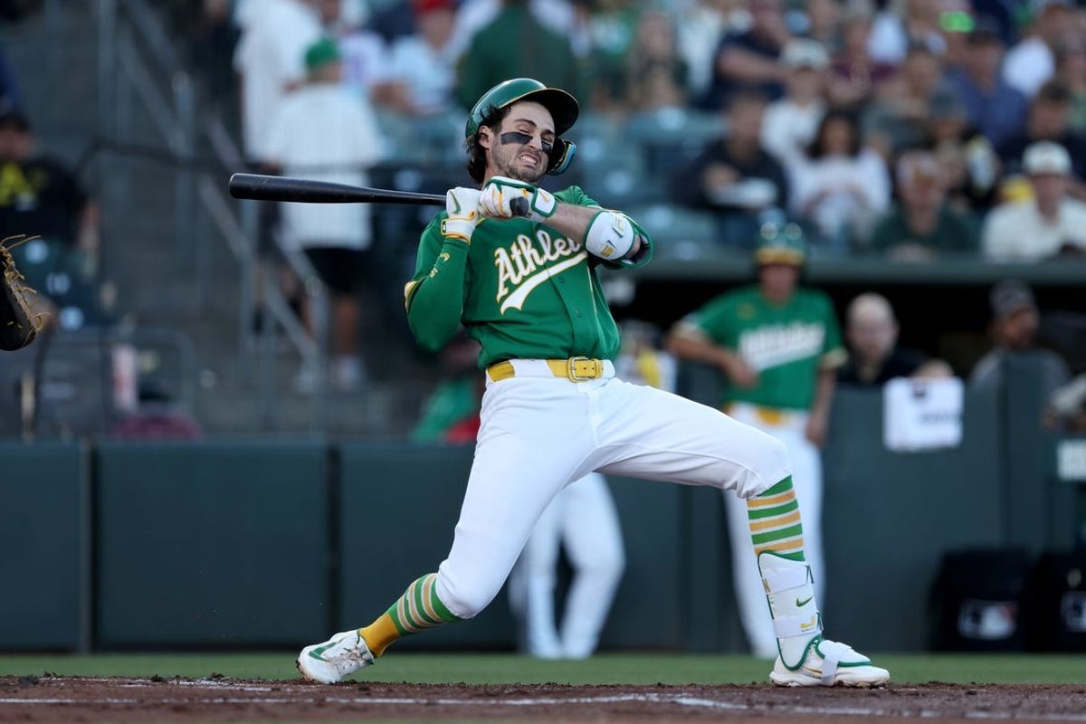 Aug 14, 2026; West Sacramento, California, USA; Athletics short stop Jacob Wilson (5) reacts after getting hit by a pitch thrown by Texas Rangers starting pitcher Kumar Rocker (not pictured) during the first inning at Sutter Health Park. Mandatory Credit: Dennis Lee-Imagn Images
