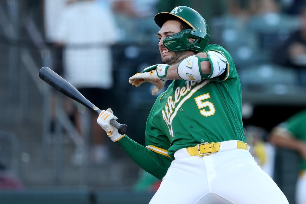 Aug 14, 2026; West Sacramento, California, USA; Athletics short stop Jacob Wilson (5) reacts after getting hit by a pitch thrown by Texas Rangers starting pitcher Kumar Rocker (not pictured) during the first inning at Sutter Health Park. Mandatory Credit: Dennis Lee-Imagn Images