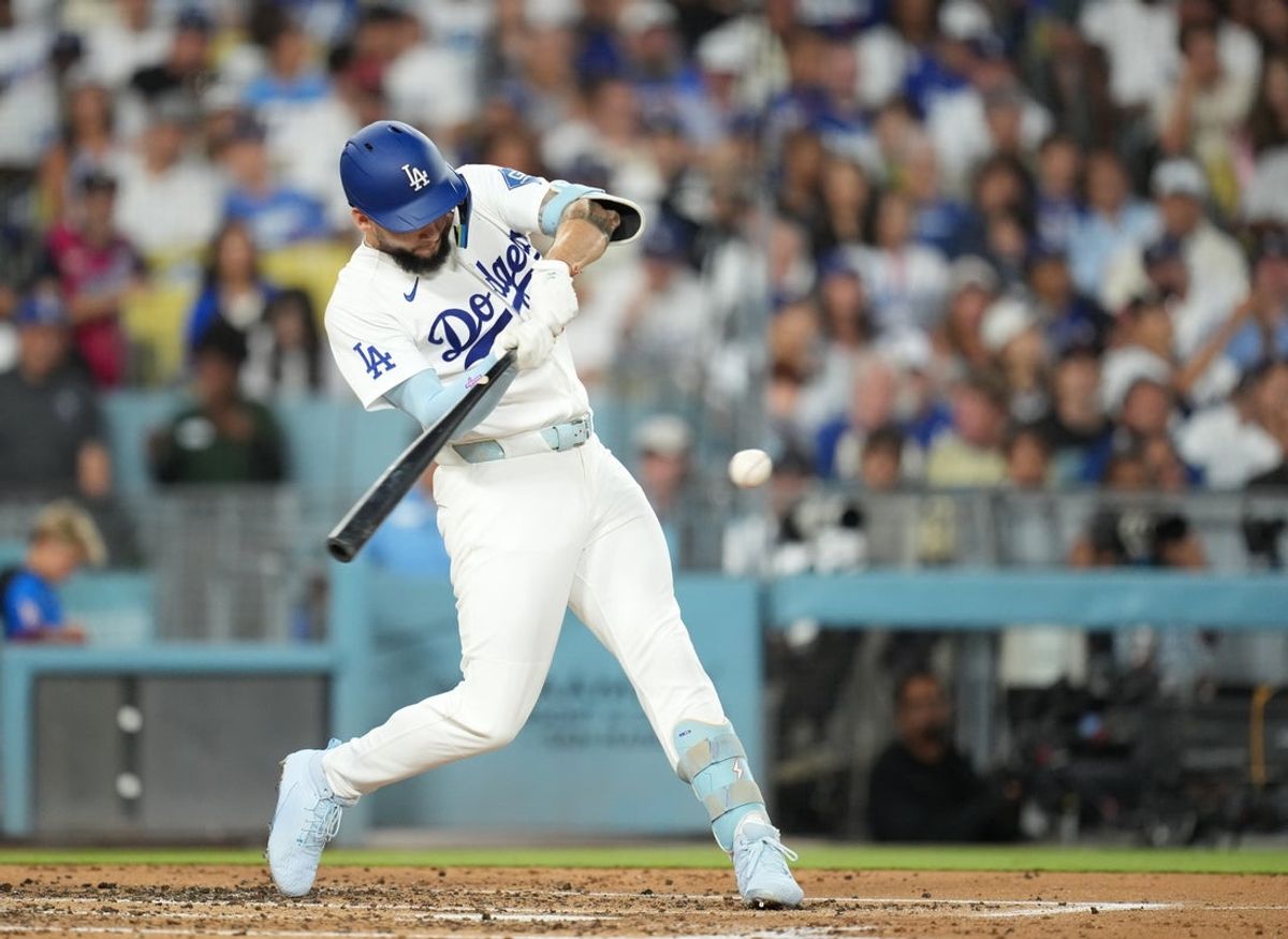 Aug 14, 2026; Los Angeles, California, USA;  Los Angeles Dodgers center fielder Andy Pages (44) hits a single during the third inning against the Milwaukee Brewers at Dodger Stadium. Mandatory Credit: Kirby Lee-Imagn Images