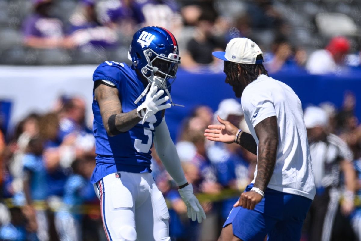 Aug 15, 2026; East Rutherford, New Jersey, USA; New York Giants wide receiver Odell Beckham Jr. (3) and wide receiver Malik Nabers (1) slap hands during warm ups before the game against the Minnesota Vikings at MetLife Stadium. Mandatory Credit: John Jones-Imagn Images