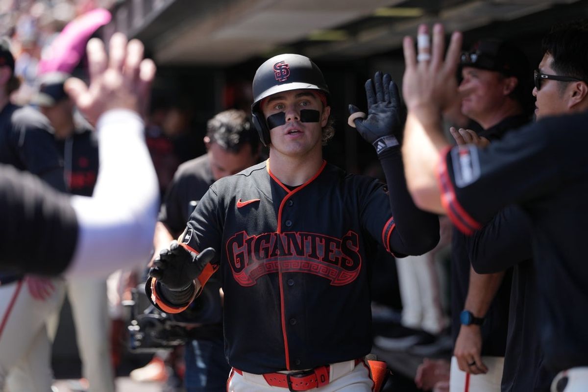 Aug 15, 2026; San Francisco, California, USA; San Francisco Giants center fielder Drew Gilbert (0) is congratulated by teammates after hitting a home run against the Colorado Rockies during the third inning at Oracle Park. Mandatory Credit: Darren Yamashita-Imagn Images