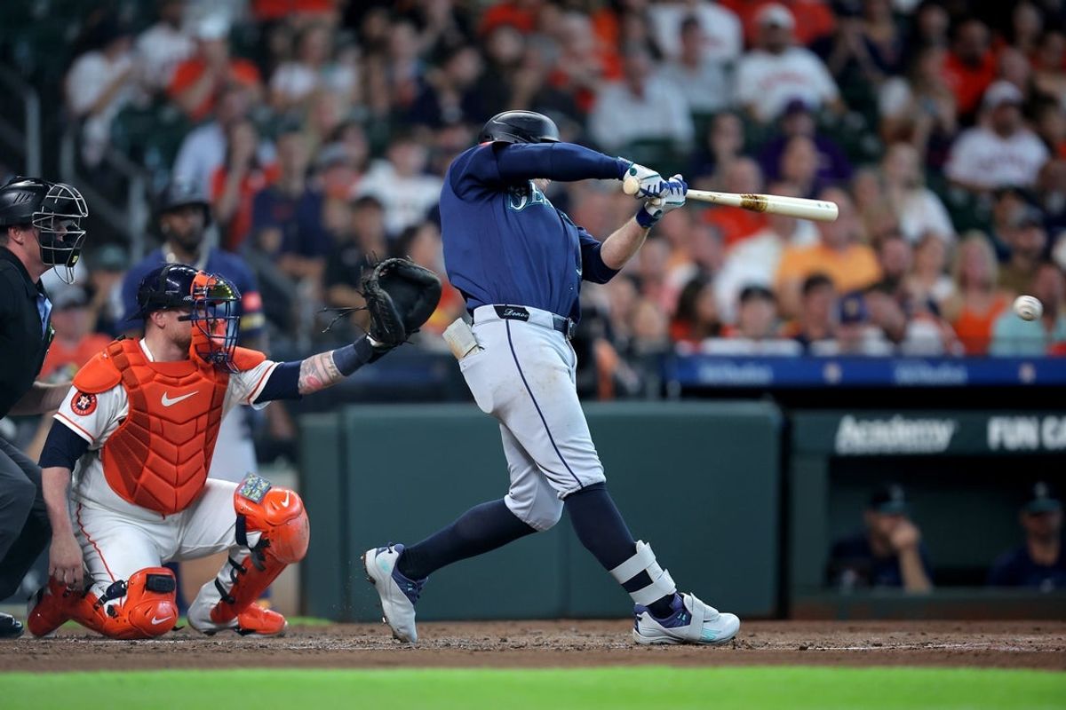 Aug 15, 2026; Houston, Texas, USA; Seattle Mariners third baseman Brendan Donovan (33) hits a RBI single against the Houston Astros during the second inning at Daikin Park. Mandatory Credit: Erik Williams-Imagn Images