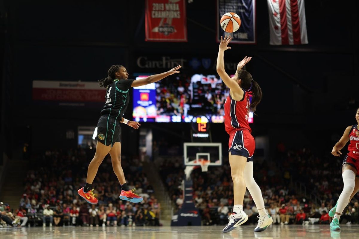 Aug 15, 2026; Washington, District of Columbia, USA; Los Angeles Sparks guard Tonie Morgan (4) leaps to pass as Washington Mystics guard Sonia Citron (22) defends during the first half at CareFirst Arena. Mandatory Credit: Geoff Burke-Imagn Images