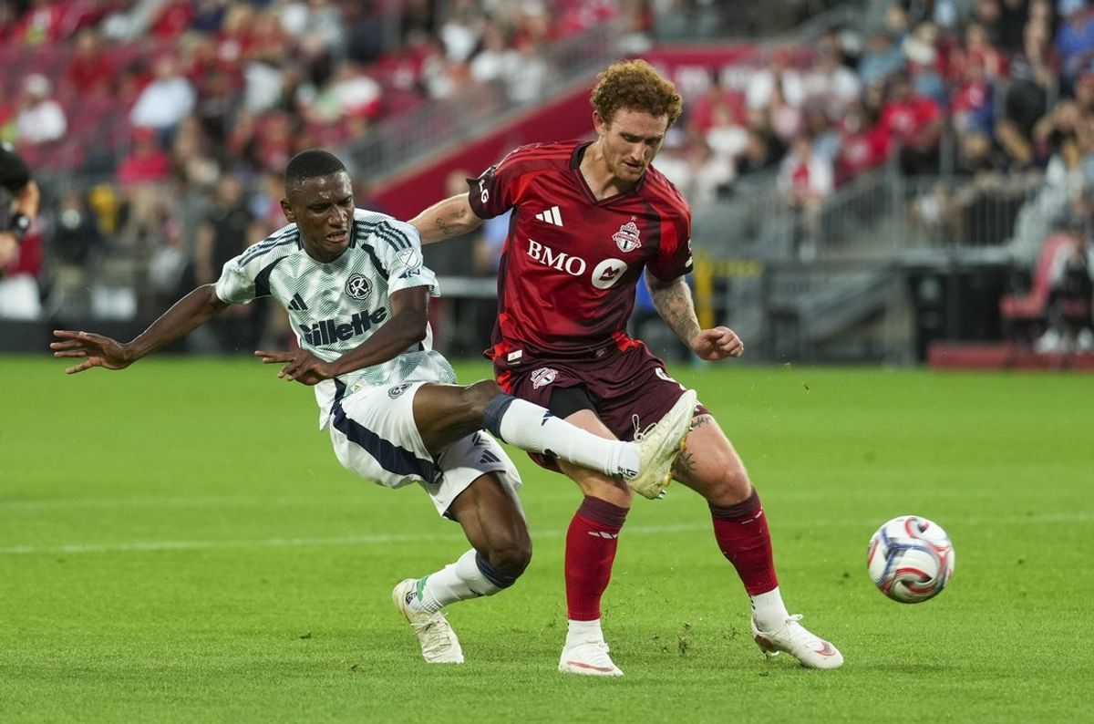Aug 15, 2026; Toronto, Ontario, CAN; New England Revolution defense Mamadou Fofana (2) shoots against Toronto FC offense Josh Sargent (9) during the first half at BMO Field. Mandatory Credit: Kevin Sousa-Imagn Images