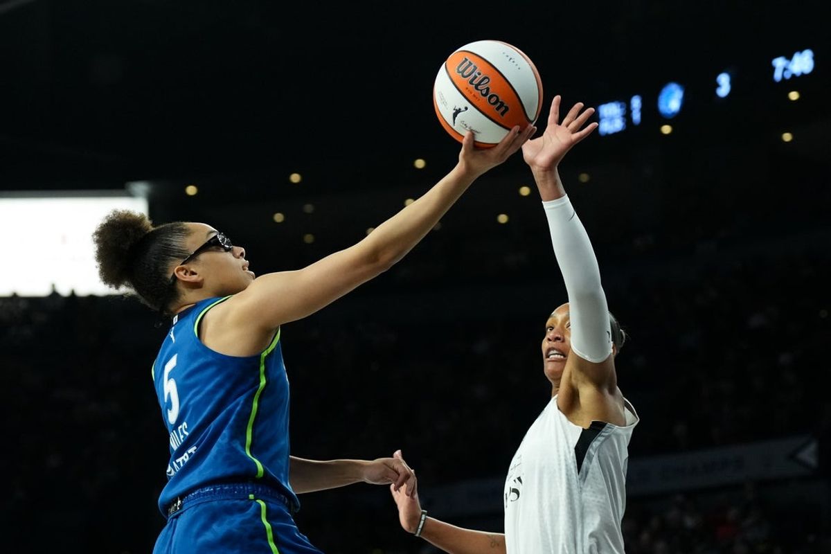 Aug 15, 2026; Las Vegas, Nevada, USA; Minnesota Lynx guard Olivia Miles (5) shoots against Las Vegas Aces center A'ja Wilson (22) in the first quarter at Michelob Ultra Arena. Mandatory Credit: Candice Ward-Imagn Images