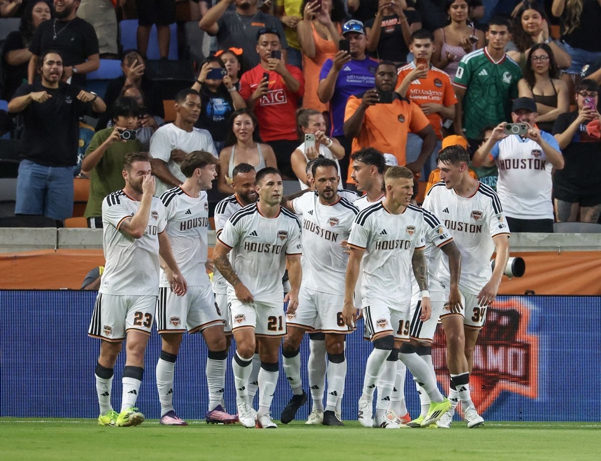 Aug 15, 2026; Houston, Texas, USA; Houston Dynamo FC midfield Guilherme Santos (20) celebrates his penalty goal with teammates against the LA Galaxy  in the first half at Shell Energy Stadium. Mandatory Credit: Thomas Shea-Imagn Images