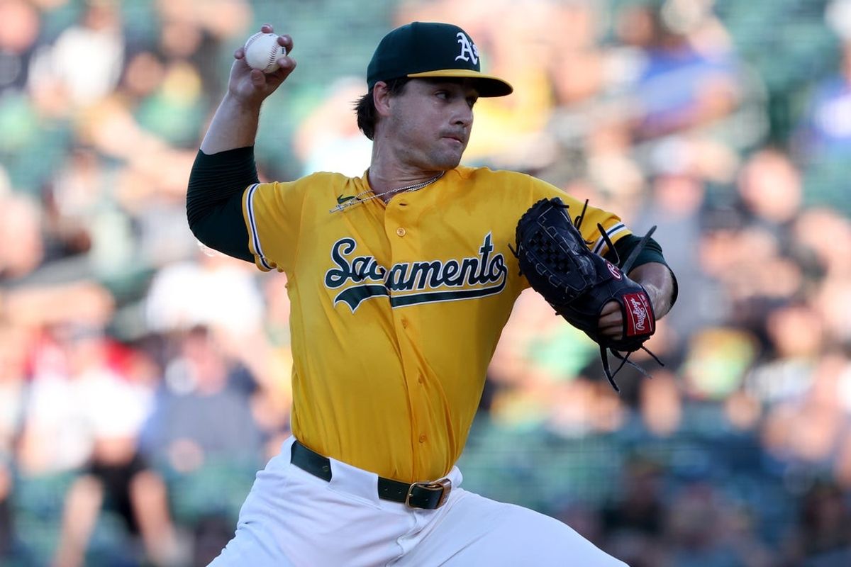 Aug 15, 2026; West Sacramento, California, USA; Athletics starting pitcher J.T. Ginn (35) throws a pitch against the Texas Rangers during the first inning at Sutter Health Park. Mandatory Credit: Dennis Lee-Imagn Images