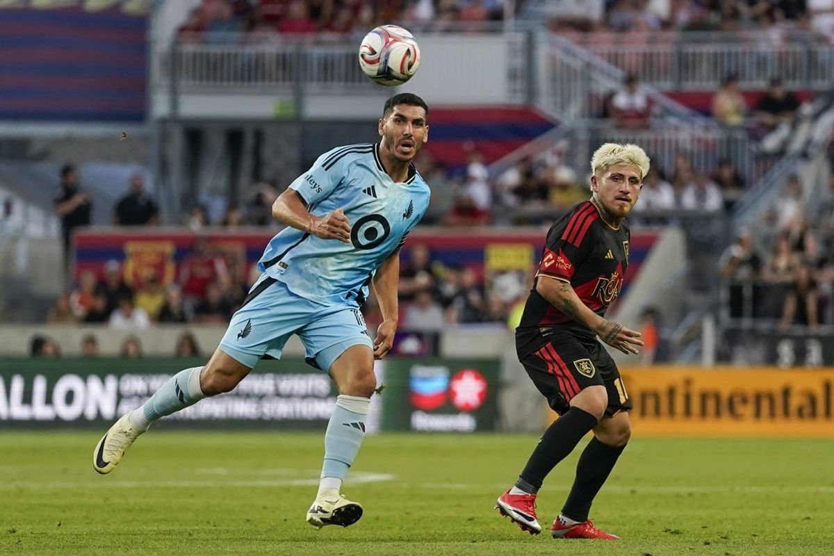Aug 15, 2026; Sandy, Utah, USA; Minnesota United FC defender Michael Boxall (15) and Real Salt Lake midfielder Diego Luna (10) battle for possession in the first half at America First Field. Mandatory Credit: Aaron Baker-Imagn Images