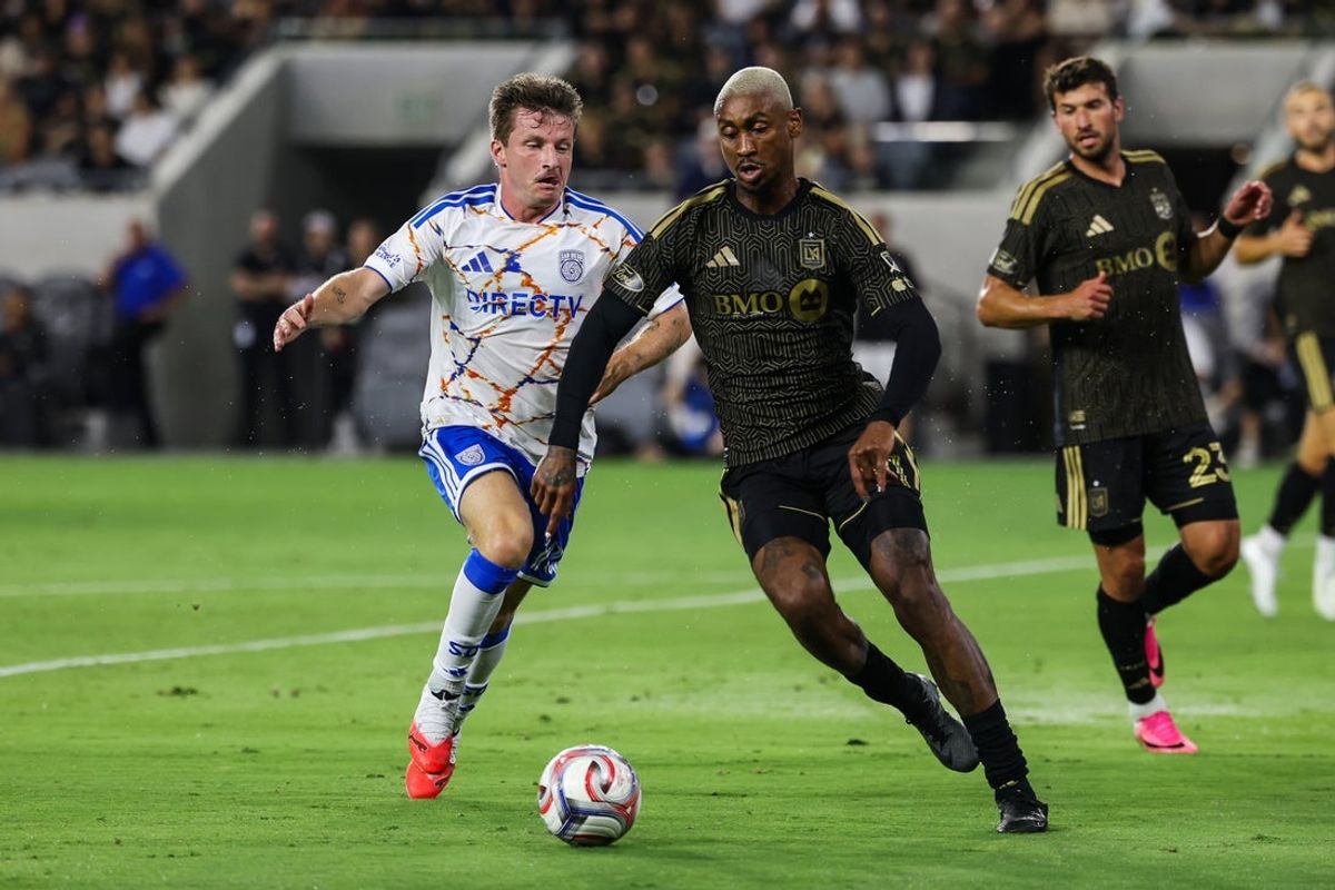 Aug 15, 2026; Los Angeles, California, USA; Los Angeles FC defender Nkosi Tafari (91) challenges San Diego FC midfield Anders Dreyer (10) for the ball during the first half at BMO Stadium. Mandatory Credit: William Navarro-Imagn Images