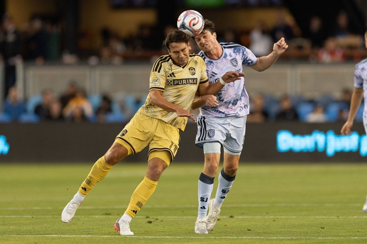 Aug 15, 2026; San Jose, California, USA;  St. Louis CITY SC offense Simon Becher (11) and San Jose Earthquakes defense Daniel Munie (5) attempt to head the ball during the first half at PayPal Park. Mandatory Credit: Stan Szeto-Imagn Images