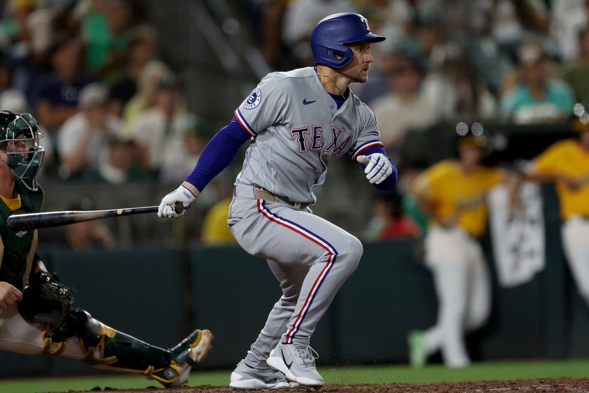 Aug 15, 2026; West Sacramento, California, USA; Texas Rangers pinch hitter Jarred Kelenic (25) hits a two RBI single against the Athletics during the ninth inning at Sutter Health Park. Mandatory Credit: Dennis Lee-Imagn Images