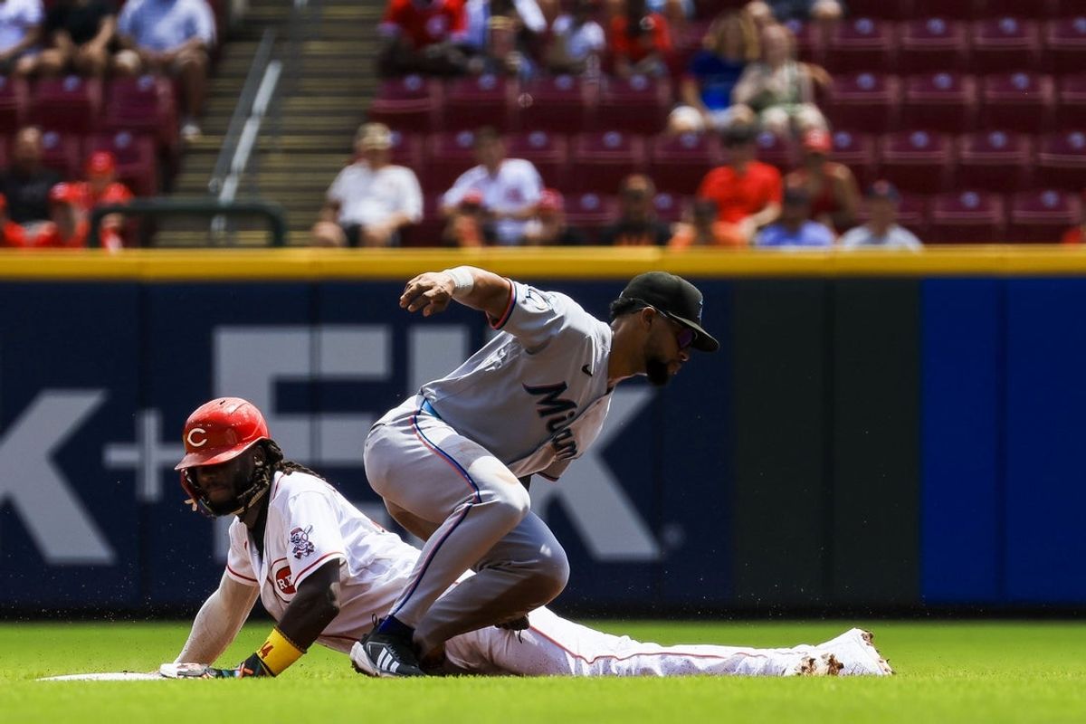 Aug 16, 2026; Cincinnati, Ohio, USA; Miami Marlins shortstop Otto Lopez (6) tags Cincinnati Reds shortstop Elly De La Cruz (44) out at second on a steal in the first inning at Great American Ball Park. Mandatory Credit: Katie Stratman-Imagn Images