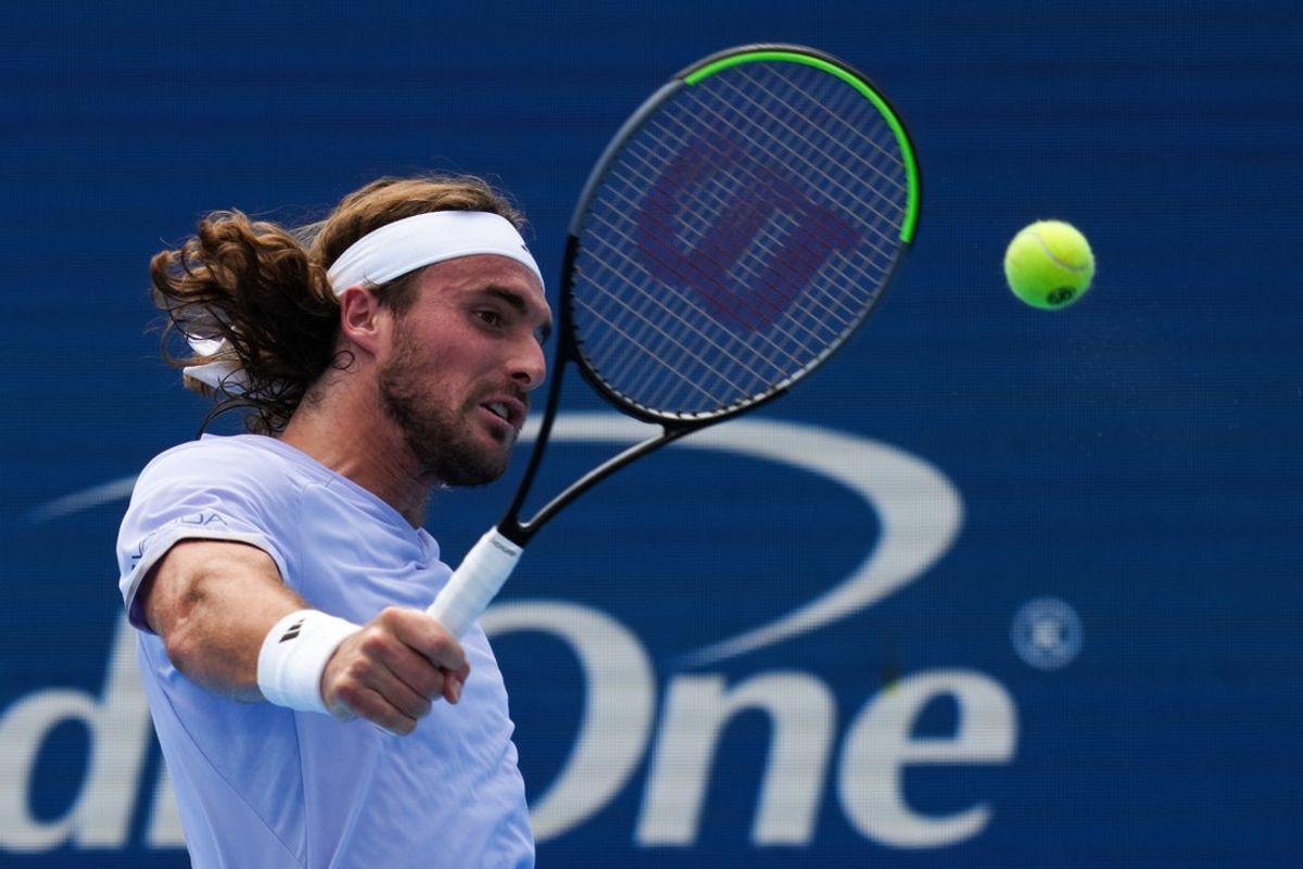 Aug 16, 2026; Mason, OH, USA;  Stefanos Tsitsipas (GRE) returns a shot against Felix Auger Aliassime (CAN) during the Cincinnati Open at Lindner Family Tennis Center. Mandatory Credit: Aaron Doster-Imagn Images
