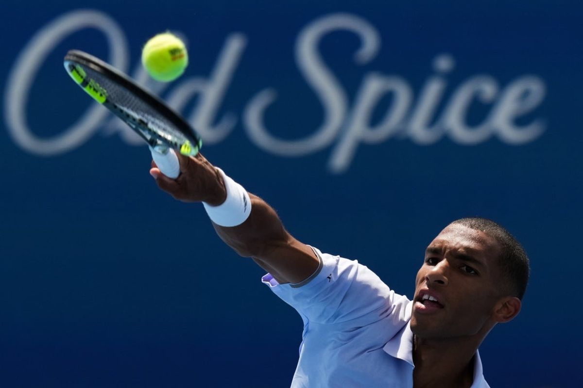 Aug 16, 2026; Mason, OH, USA;  Felix Auger Aliassime (CAN) returns a shot against Stefanos Tsitsipas (GRE) during the Cincinnati Open at Lindner Family Tennis Center. Mandatory Credit: Aaron Doster-Imagn Images