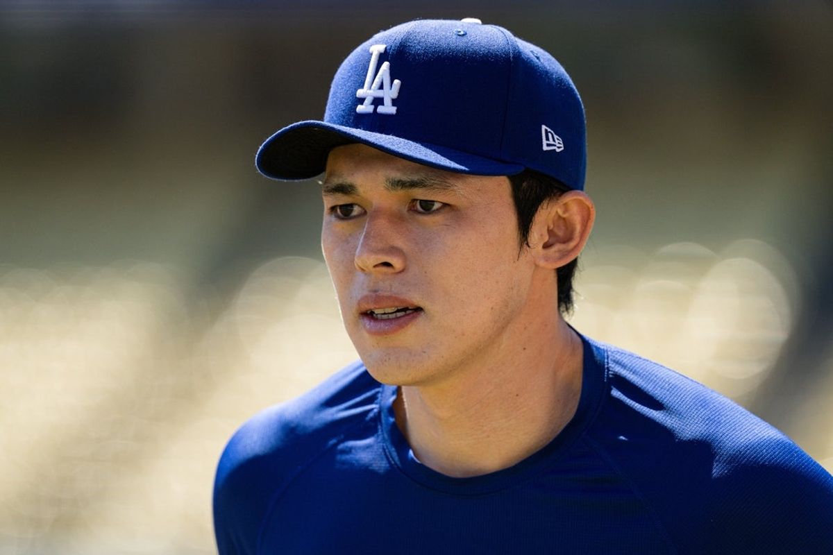 Aug 16, 2026; Los Angeles, California, USA; Los Angeles Dodgers pitcher Roki Sasaki (11) during pregame warmup against the Milwaukee Brewers at Dodger Stadium. Mandatory Credit: Jon Endow-Imagn Images