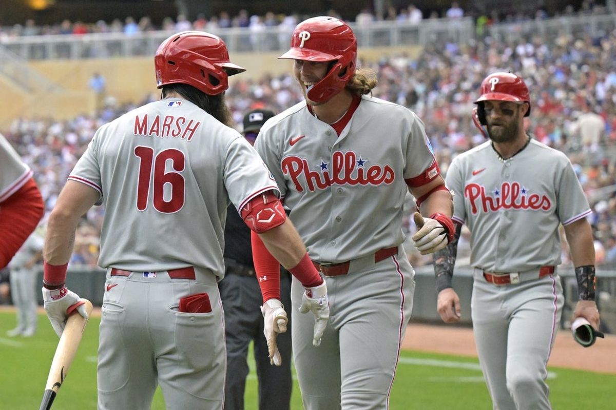 Aug 16, 2026; Minneapolis, Minnesota, USA;  Philadelphia Phillies infielder Alec Bohm (28) celebrates his three-run home run against the Minnesota Twins with outfielder Brandon Marsh (16) during the sixth inning at Target Field. Mandatory Credit: Nick Wosika-Imagn Images