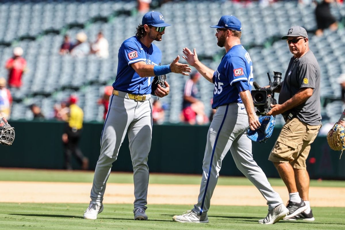 Aug 16, 2026; Anaheim, California, USA; Kansas City Royals pitcher Noah Cameron (65) and right fielder Jac Caglianone (14) celebrate a victory against the Los Angeles Angels at Angel Stadium. Mandatory Credit: William Navarro-Imagn Images
