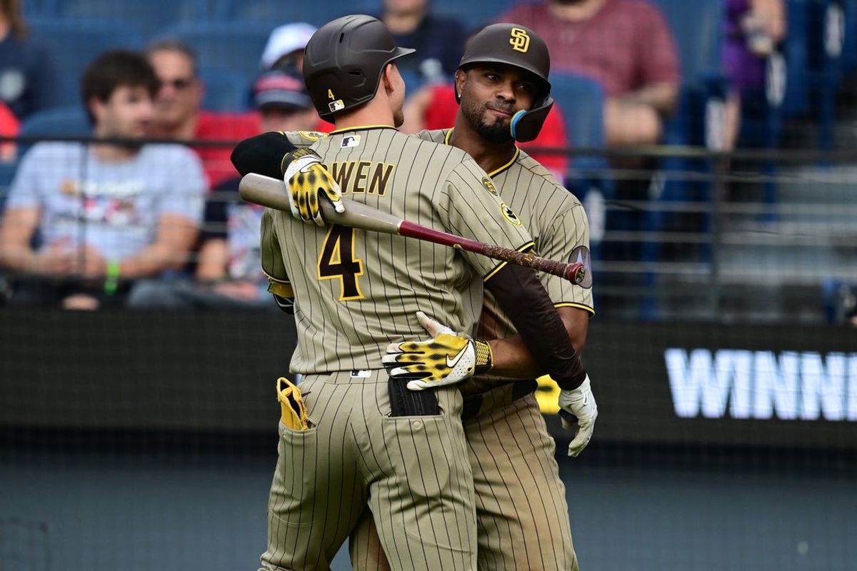 Aug 16, 2026; Cleveland, Ohio, USA; San Diego Padres left fielder Jase Bowen (4)is congratulated by shortstop Xander Bogaerts (2) after hitting a solo home run during the eighth inning against the Cleveland Guardians at Progressive Field. Mandatory Credit: David Dermer-Imagn Images