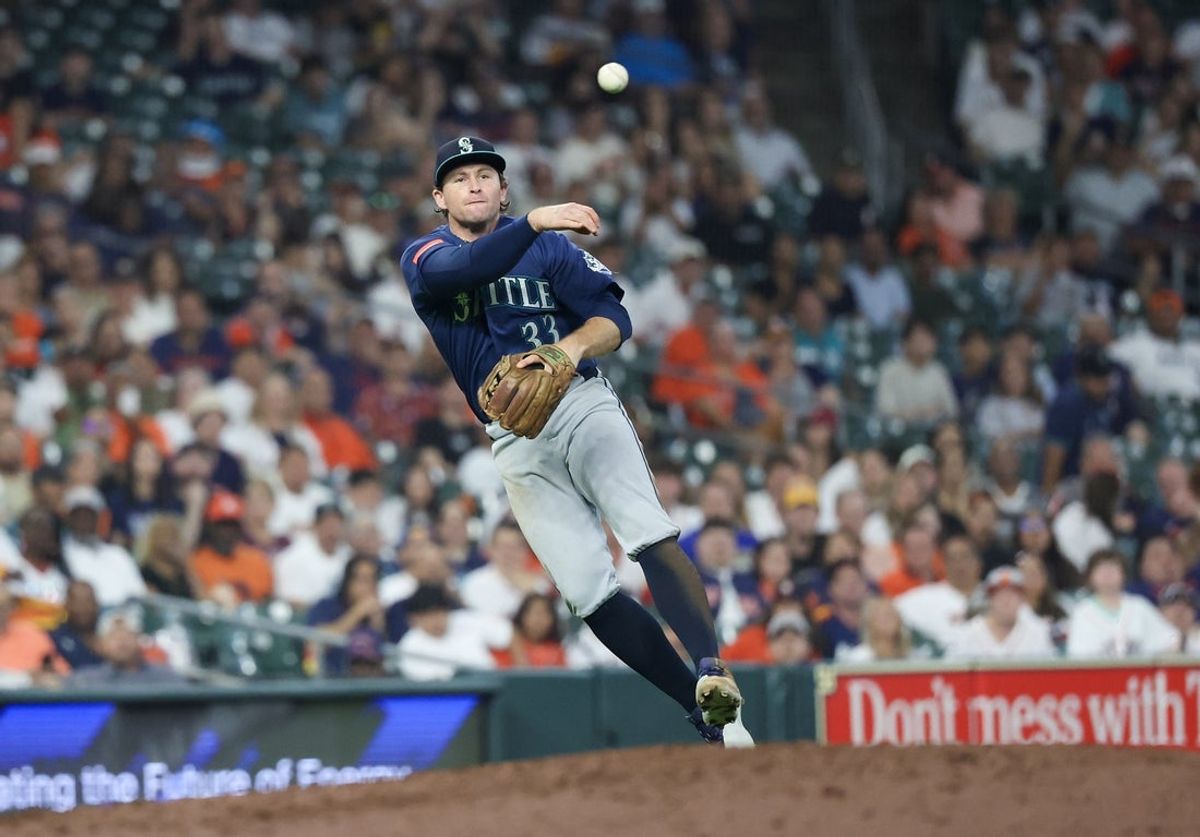 Aug 16, 2026; Houston, Texas, USA; Seattle Mariners third baseman Brendan Donovan (33) throws out Houston Astros catcher Yainer Diaz (not pictured) at first base in the fifth inning at Daikin Park. Mandatory Credit: Thomas Shea-Imagn Images