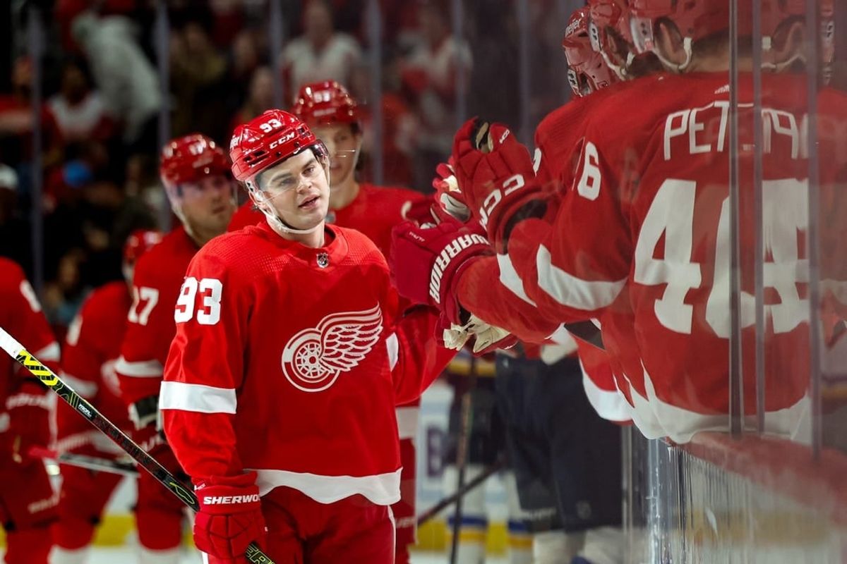 Feb 24, 2024; Detroit, Michigan, USA;  Detroit Red Wings right wing Alex DeBrincat (93) receives congratulations from teammates after scoring in the first period against the St. Louis Blues at Little Caesars Arena.