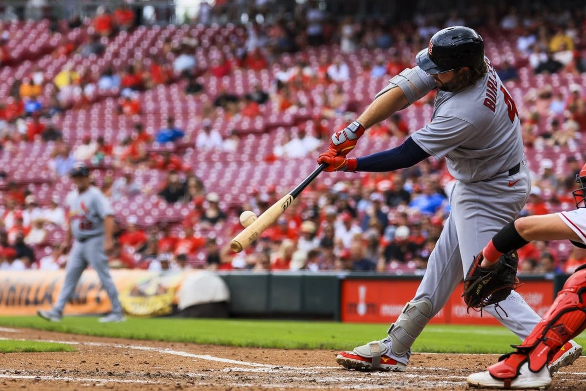 Aug 17, 2026; Cincinnati, Ohio, USA; St. Louis Cardinals first baseman Alec Burleson (41) hits a single in the third inning against the Cincinnati Reds at Great American Ball Park. Mandatory Credit: Katie Stratman-Imagn Images