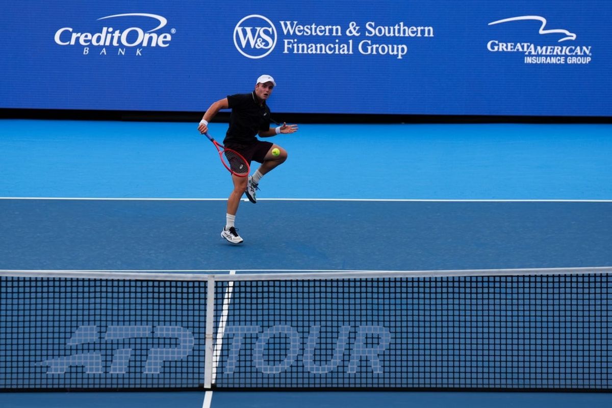 Aug 17, 2026; Mason, OH, USA;  Arthur Fery (GBR) returns a shot against Alex de Minaur (AUS) during the Cincinnati Open at Lindner Family Tennis Center. Mandatory Credit: Aaron Doster-Imagn Images