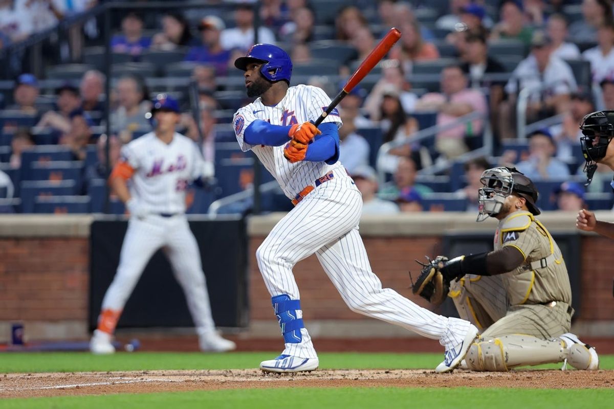 Aug 17, 2026; New York City, New York, USA; New York Mets center fielder Luis Robert Jr. (88) follows through on an RBI sacrifice fly against the San Diego Padres during the first inning at Citi Field. Mandatory Credit: Brad Penner-Imagn Images