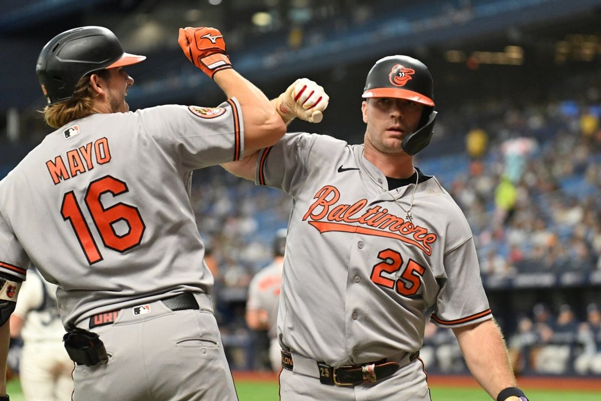 Aug 17, 2026; St. Petersburg, Florida, USA; Baltimore Orioles designated hitter Pete Alonso (25) celebrates with first baseman Coby Mayo (16) after hitting a solo home run in the fifth inning against the Tampa Bay Rays at Tropicana Field. Mandatory Credit: Jonathan Dyer-Imagn Images