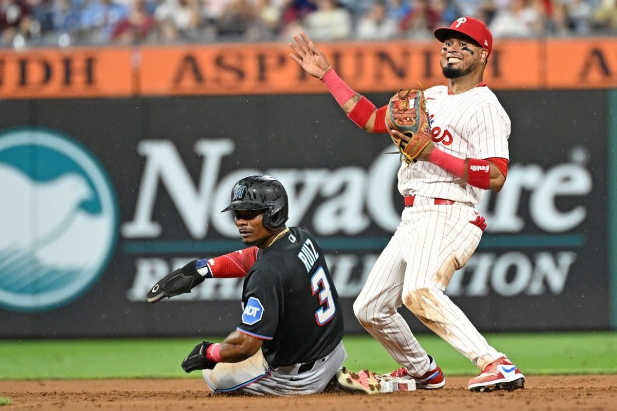 Aug 17, 2026; Philadelphia, Pennsylvania, USA; Philadelphia Phillies second baseman Luis Arraez (4) and Miami Marlins right fielder Esteury Ruiz (3) watch the play at first base after getting force out during the fifth inning at Citizens Bank Park. Mandatory Credit: Eric Hartline-Imagn Images