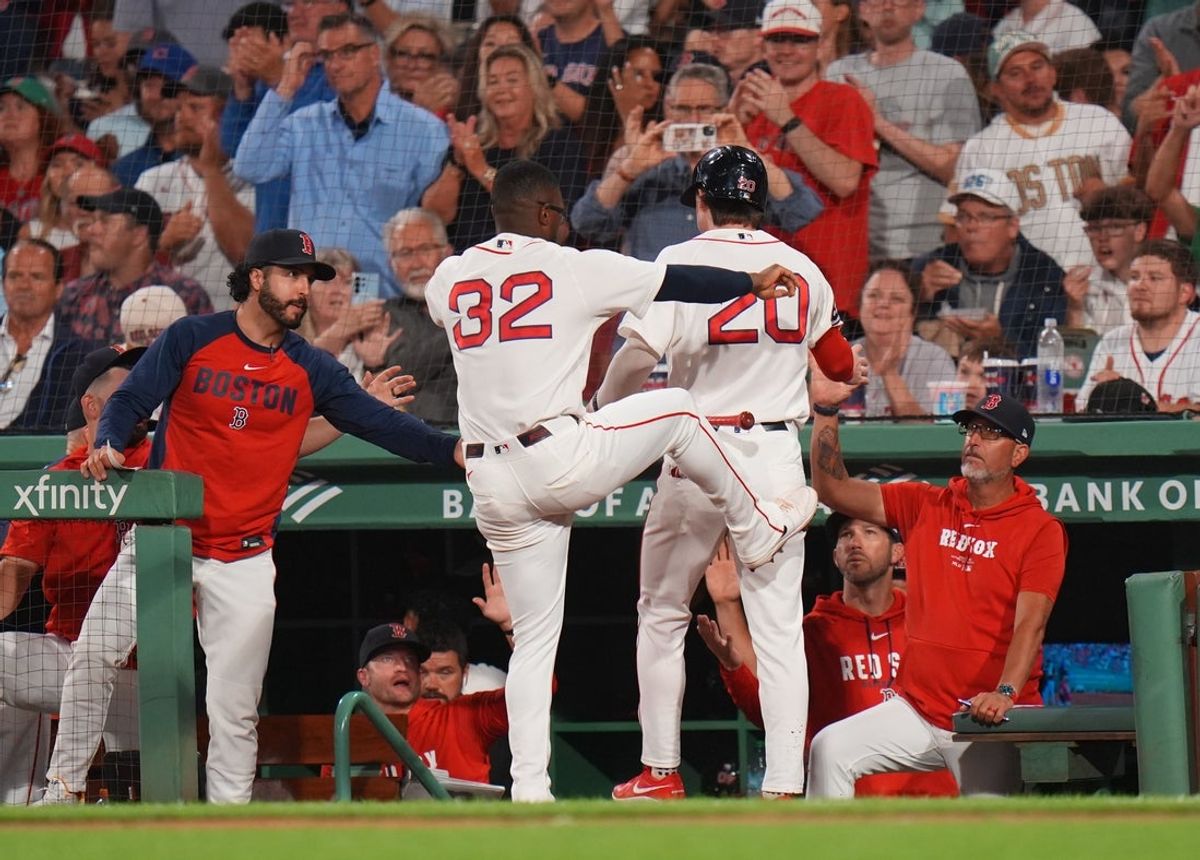 Aug 17, 2026; Boston, Massachusetts, USA; Boston Red Sox second baseman Nick Sogard (20) is congratulated after scoring against the Arizona Diamondbacks in the fourth inning at Fenway Park. Mandatory Credit: David Butler II-Imagn Images
