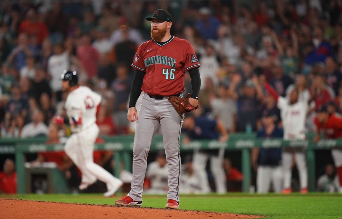 Aug 17, 2026; Boston, Massachusetts, USA; Arizona Diamondbacks pitcher Zack Littell (46) looks on as Boston Red Sox first baseman Willson Contreras (40) hits a home run in the fifth inning at Fenway Park. Mandatory Credit: David Butler II-Imagn Images