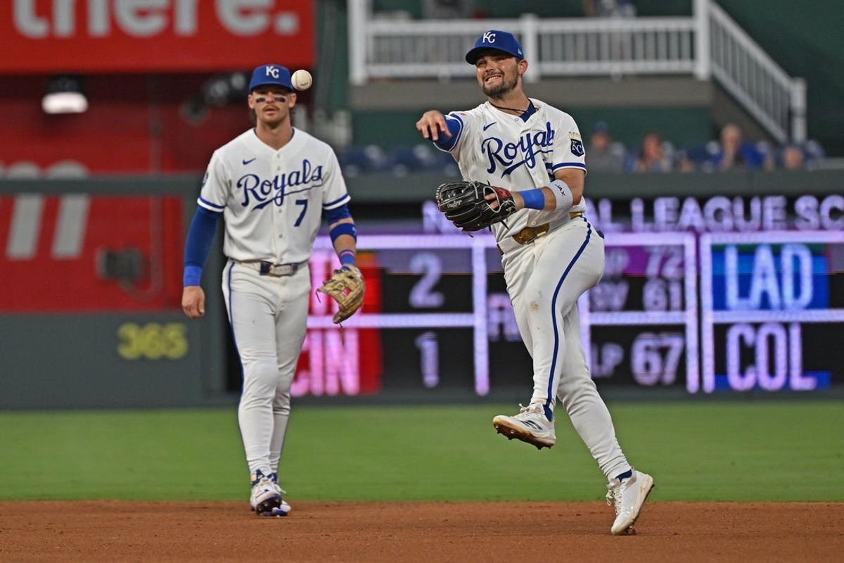 Aug 17, 2026; Kansas City, Missouri, USA;  Kansas City Royals second baseman Michale Massey (19) throws to first base for an out, as shortstop Bobby Witt Jr. (7) looks on in the fourth inning against the Athletics at Kauffman Stadium. Mandatory Credit: Peter Aiken-Imagn Images