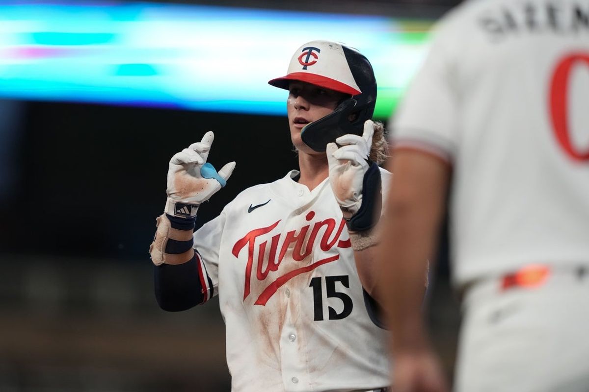 Aug 17, 2026; Minneapolis, Minnesota, USA; Minnesota Twins right fielder Luke Keaschall (15) reacts after hitting a single during the second inning against the Atlanta Braves at Target Field. Mandatory Credit: Jordan Johnson-Imagn Images