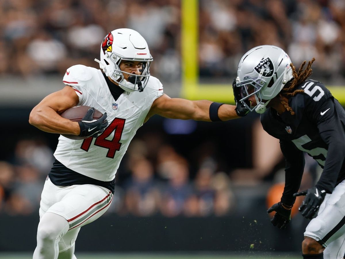 Aug 13, 2026; Paradise, Nevada, USA; Arizona Cardinals wide receiver Michael Wilson (14) stiff-arms Las Vegas Raiders cornerback Eric Stokes (5) after making a catch during the game at Allegiant Stadium. Mandatory Credit: David Brytus-Imagn Images